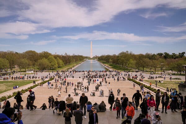 Crowds on the National Mall in April. Resistance to the vaccines is a main reason the United States is unlikely to reach herd immunity, but it is not the only one.