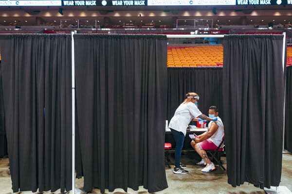 Vaccinations at the American Airlines Arena in Miami on Thursday. Though there is consensus among scientists and public health experts that the herd immunity threshold is not attainable, it may not be all bad news.