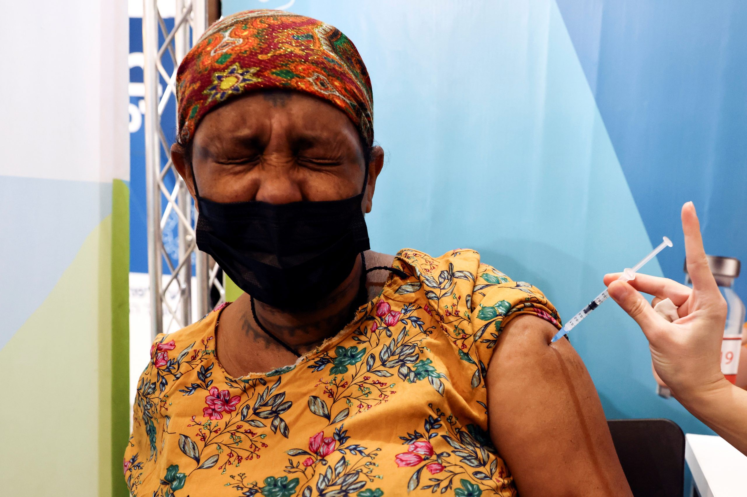 An Israeli woman receives her third dose of the coronavirus disease (COVID-19) vaccine, in Jerusalem, October 3, 2021.